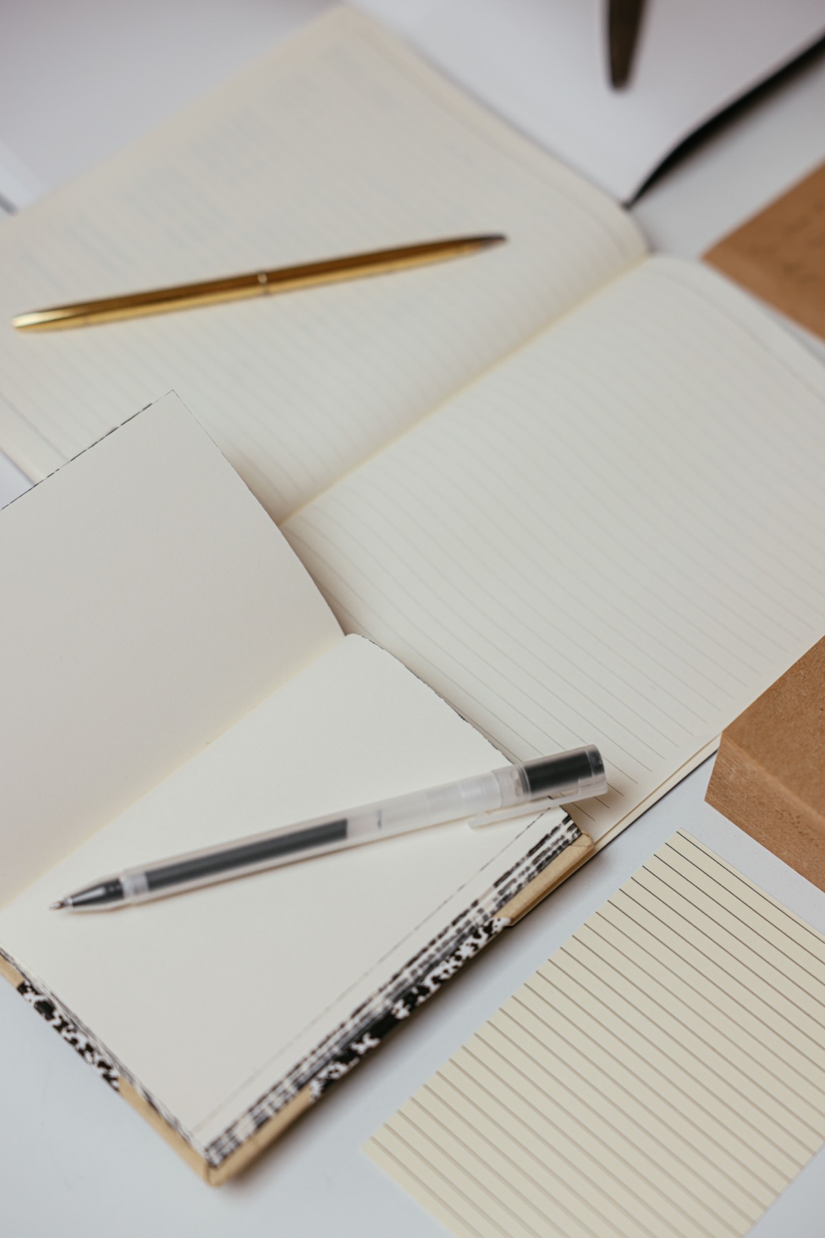 Open notebooks with pens ready for writing